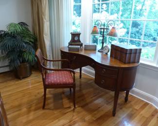 Kidney shaped desk, desk chair, lamp, bric-a-brac