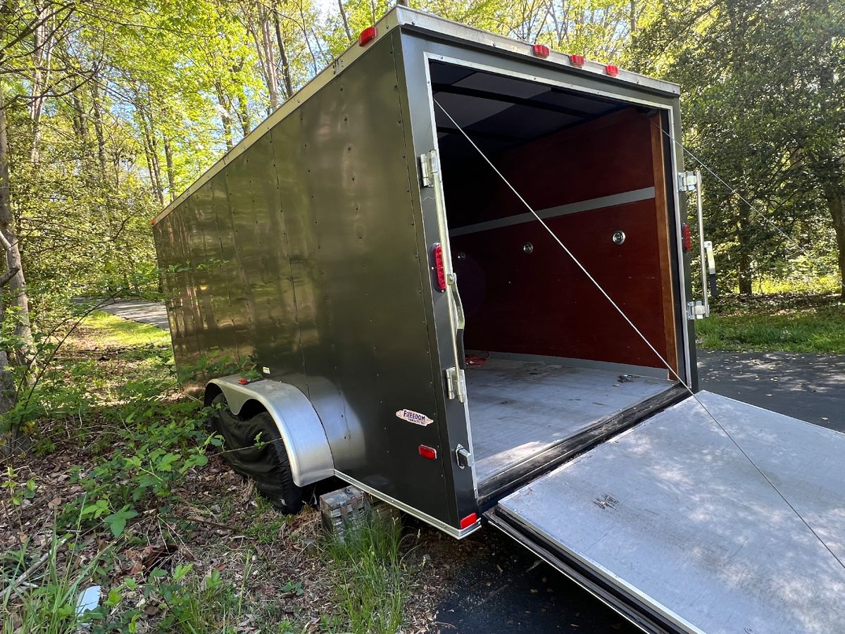 2015 Freedom 16’ x 7’ Enclosed Trailer with:
Clear Title – Dual Wheels – Fold Down Ramp – 
Multi Tie-Downs – Spare Tire!!
