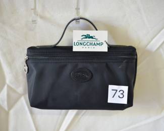 BUY IT NOW! $35. Longchamp Le Pliage Zip Top Black Nylon with Brown Leather Handle Cosmetic Pouch. Dimensions are approx. 8"W x 5"H x 1"D.