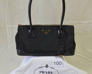 BUY IT NOW! $800. Prada Tessuto,  Black Nylon Handbag and Cosmetic Pouch. Bag dimensions are approx. 11"W x 6.5"H x 4"D. Cosmetic Case Vela dimensions are approx. 7"W x 3"H x 3"D.