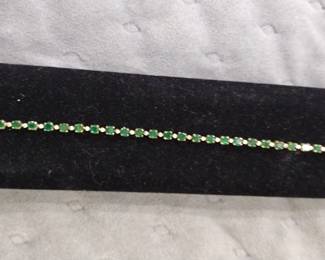 14K Gold Emerald and diamond tennis bracelet.