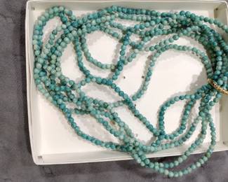 Strands of turquoise beads for. jewelry, making