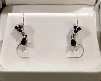 14K White Gold and sapphire earrings. Sorry. The photo makes them look black