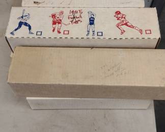Boxs is full of vintage baseball and football cards.