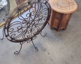 metal home decor and carved plant stand 