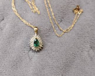 14K Emerald and diamonds.
