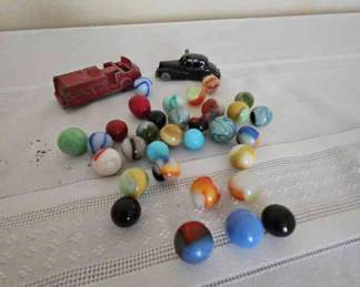 Marbles And A Couple Metal Cars