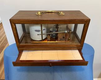 Barograph. The drawer contains several sheets with measurements and specifications as well as a receipt for the paper used in the barograph.