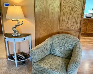 Designer glider rocker barrel chair, $75 excellent condition
Driftwood lamp $50
Antique table $40