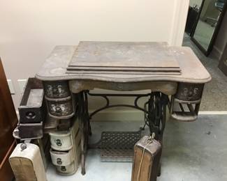 Singer sewing machine that has seen better days and extra drawers