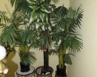 Selection of fake palms and plant stands.