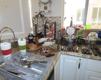 Flatware, utensils, wine rack, wine holders, knives, dip bowls.