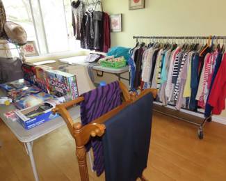Clothing, board games, playing cards, quilt rack.