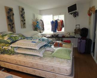 Bedroom, bed linens, luggage.