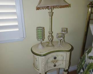 decorative end table , table lamp and candles.