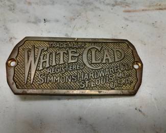 White Clad Simmons Hardware Brass Tag