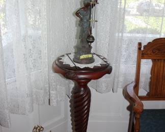 French swing arm clock; wood pedestal