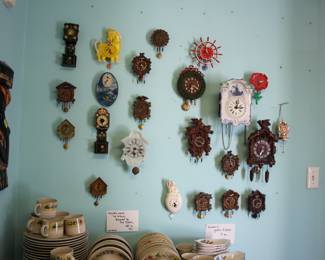 Assorted mini cuckoo clocks and figural novelty clocks