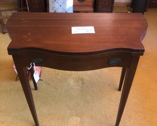 Antique convertible table with hidden compartment
$45