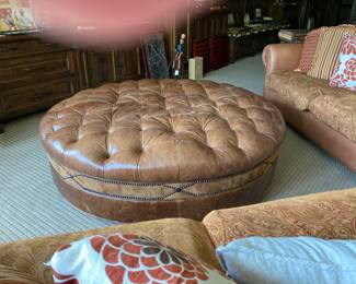 Large round leather ottoman 