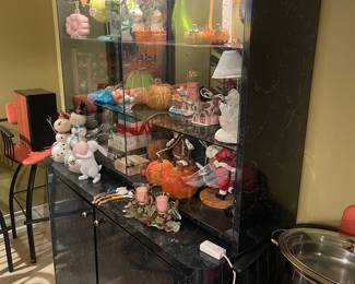 Custom two-piece display cabinet full of various decorations