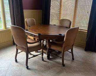 Poker Card table with reversible top
36” Dia 
Leather on one side / Wood on other 
4 chairs on wheels 
ALL for $1000 

Gorgeous table !!! 
