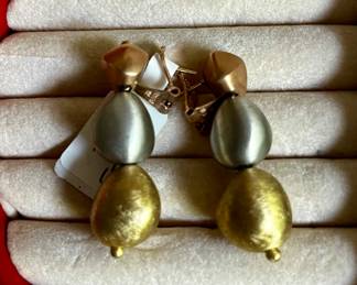 Pair of 14 karat gold earrings trademarked Aurafin.  Each earring is made of three hollow asymmetrical beads.  The top bead is Rose gold, center bead is white gold and a yellow gold bead is on the bottom.  the estimated replacement value of these earrings is $1600.00.  Appraisal by Korona Jewelry Buffalo, NY