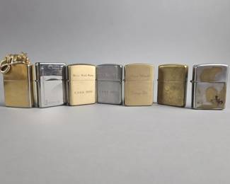 Lot 564 | Engraved Zippo Lighters & More!
