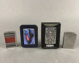 Lot 518 | 4 Zippo Lighters