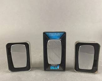 Lot 541 | 3 Zippo BLU Lighters