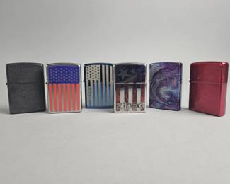 Lot 567 | Zippo Flag Graphic Lighters & More!
