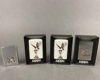 Lot 537 | Flame Art Bird Zippo Lighters & More