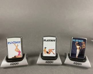 Lot 466 | 3 Zippo Playboy Lighters With Magnetic Stands