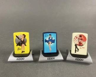 Lot 473 | 3 Pin Up Girls Zippo Lighters