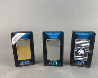 Lot 542 | 18k Gold Plated Zippo BLU & More