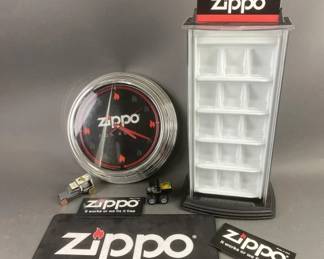 Lot 330 | Zippo Display Case, Clock & More