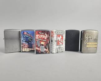 Lot 557 | Zippo Graphic Windproof Lighters