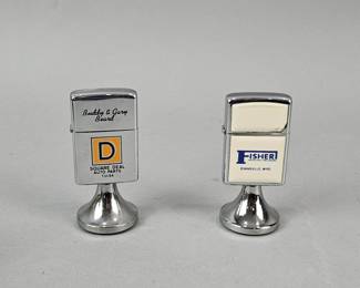 Lot 556 | 2 Tabletop Zippo Lighters