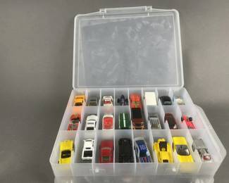 Lot 124 | 48 Hot Wheels/ Matchbox Cars With Case
