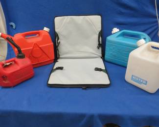 Lot 113. Two gas cans, two water cans, and a folding seat-back