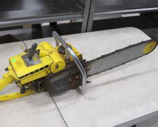 Lot 137. D36 McCulloch chain saw with compression and gas can