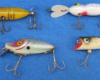 Lot 74. Four vintage baits