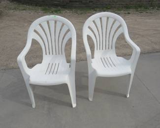 Lot 268. Two plastic patio chairs
