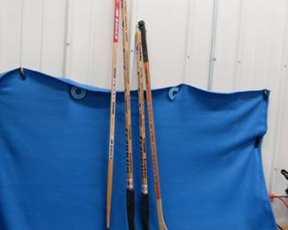 Lot 169. Two ice hockey and two street hockey sticks