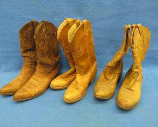 Lot 160. Three pairs of cowboy boots. They look like the same size. One is marked 8 1/2 D. The other is marked