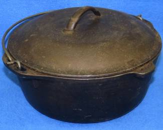 Lot 19. Vintage {#}8 10 1/4" cast-iron Dutch oven with matching self-basting lid