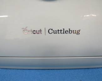 Lot 213. Cricut Cuttlebug with a cover