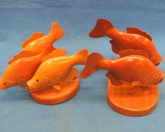 Lot 372. Five wooden 360 degrees carved crappies on two separate stands.