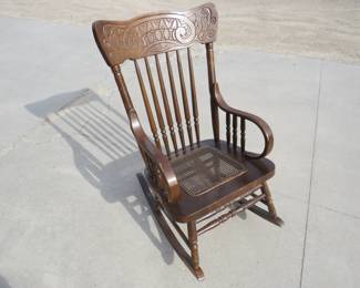 Lot 244. Wooden rocking chair with wicker seat