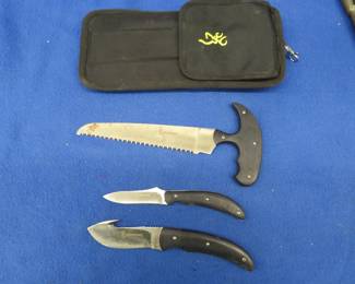 Lot 24. Browning field dressing knife set and a Buck knife